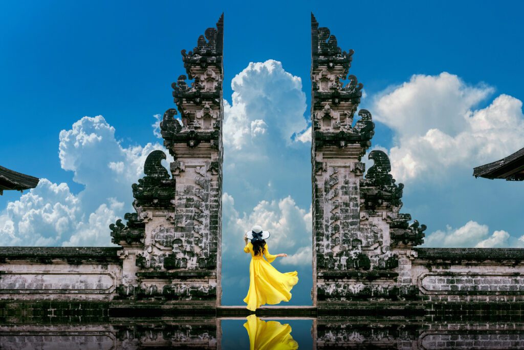 young woman standing in Luhur temple in Bali 